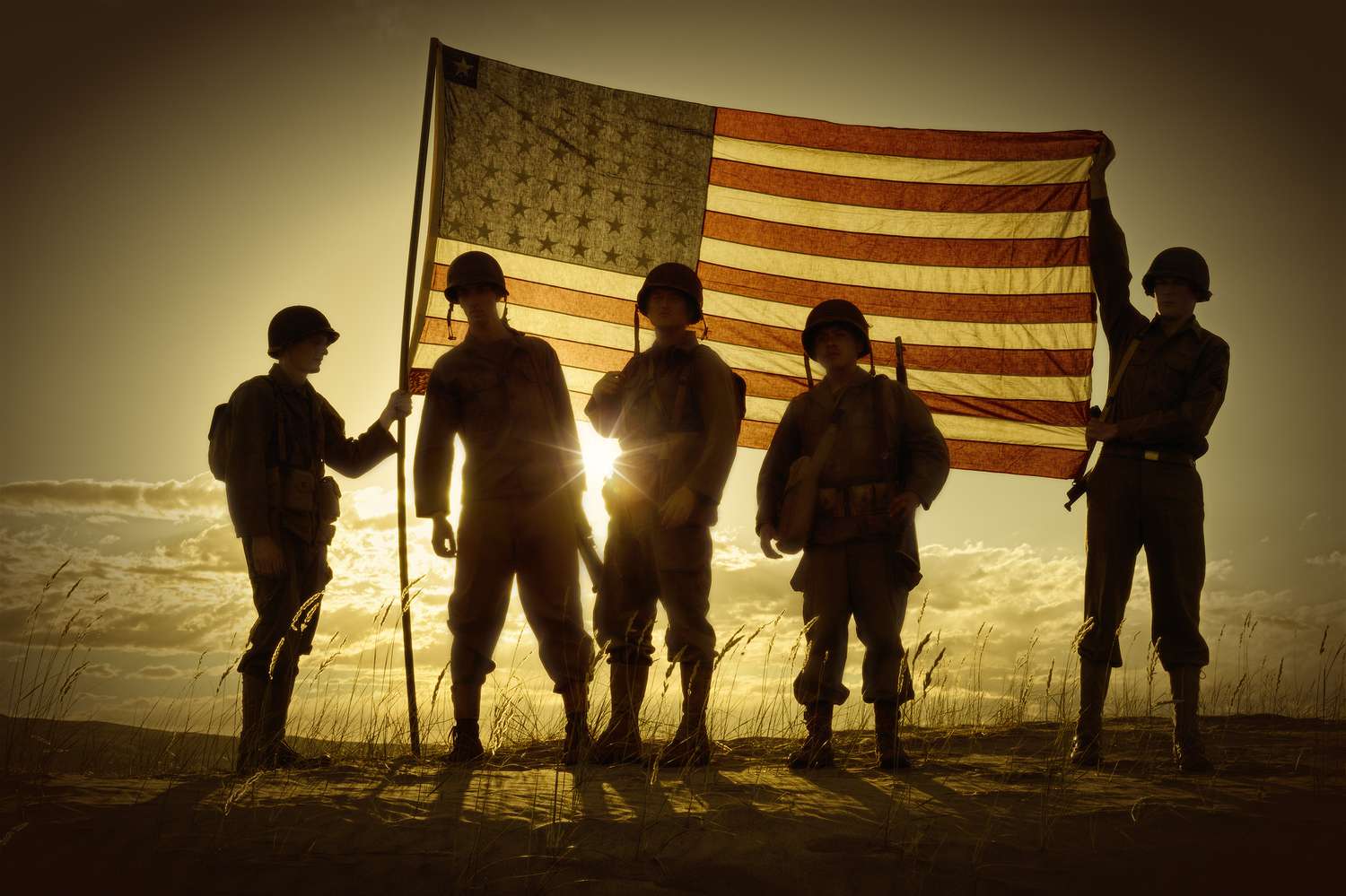 silhouette-of-soldiers-with-american-flag-186546665-5c7ac4ff46e0fb0001edc832.jpg